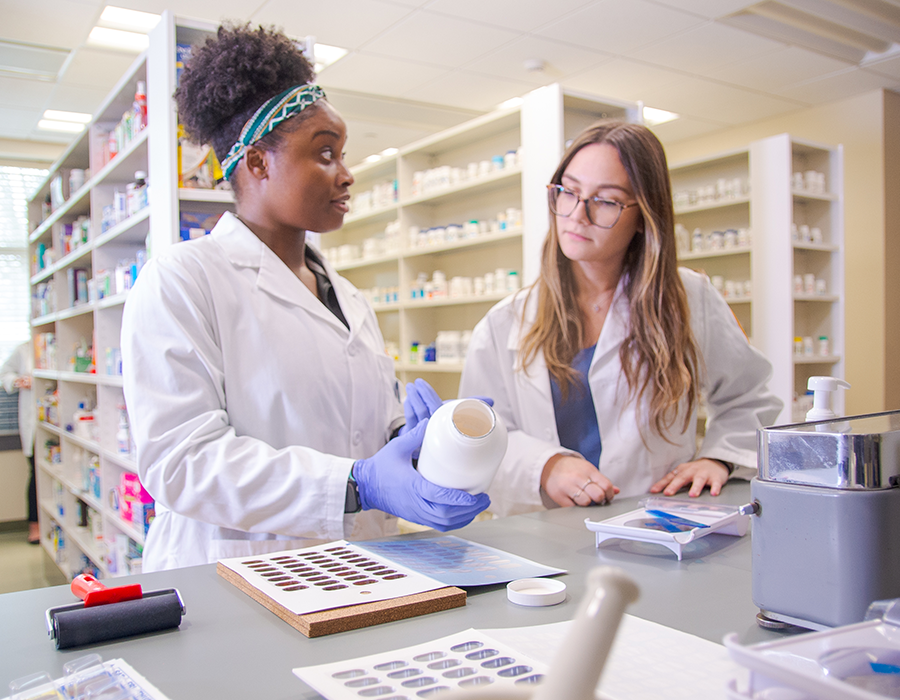 Students in model pharmacy