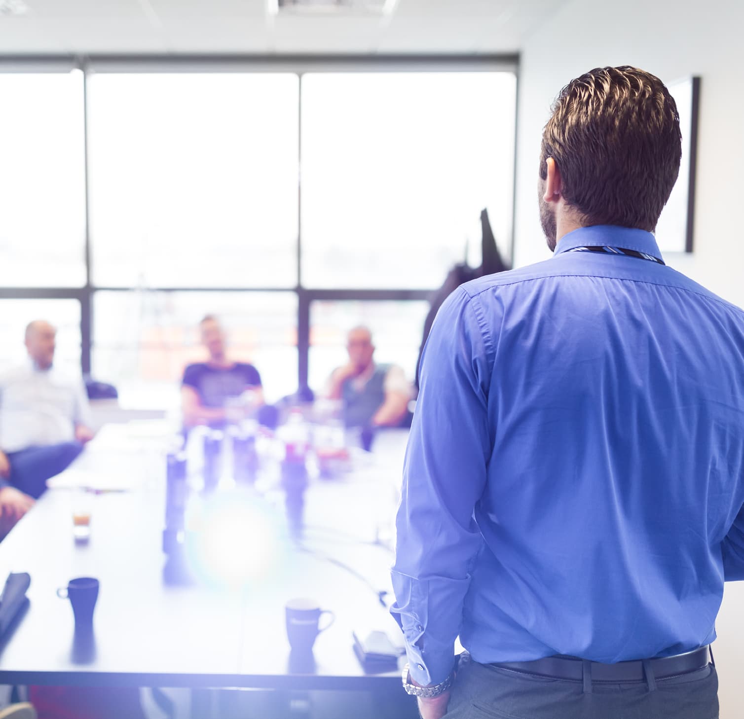 Man standing in front of meeting