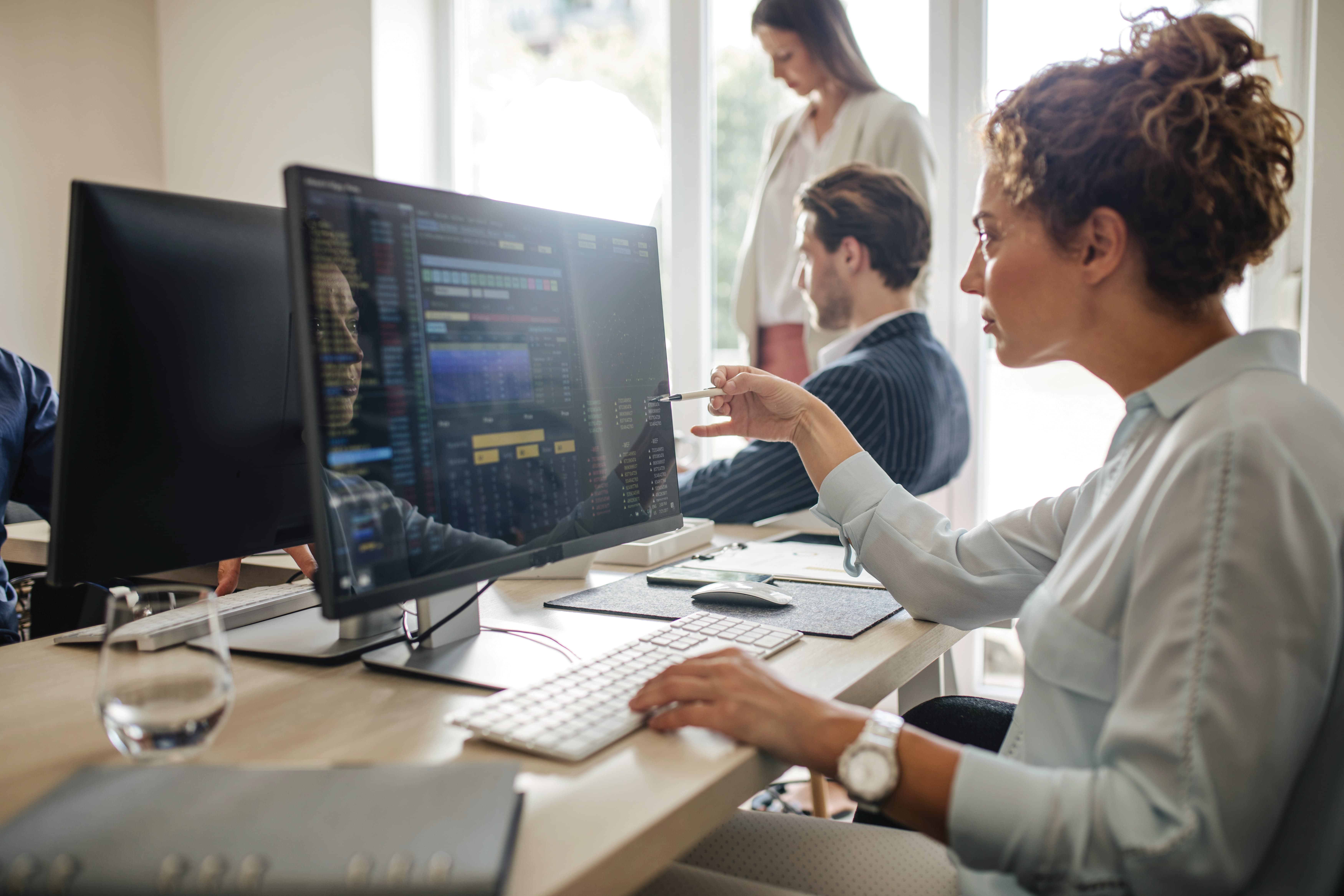 Engineers working at a computer