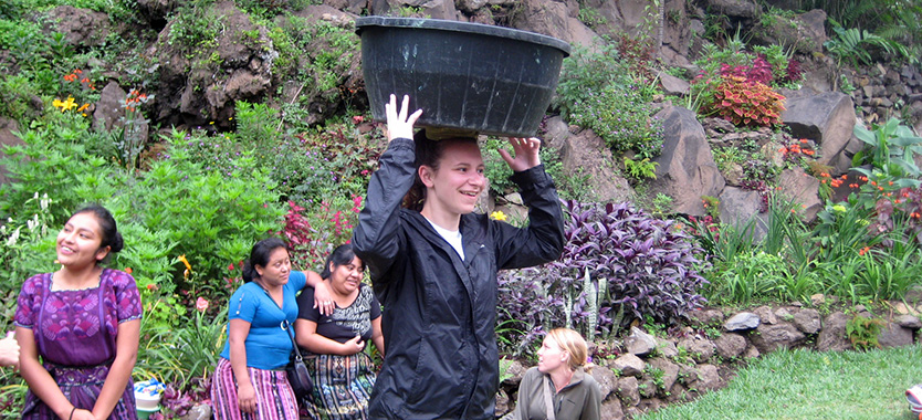 girl with water bucket on her head