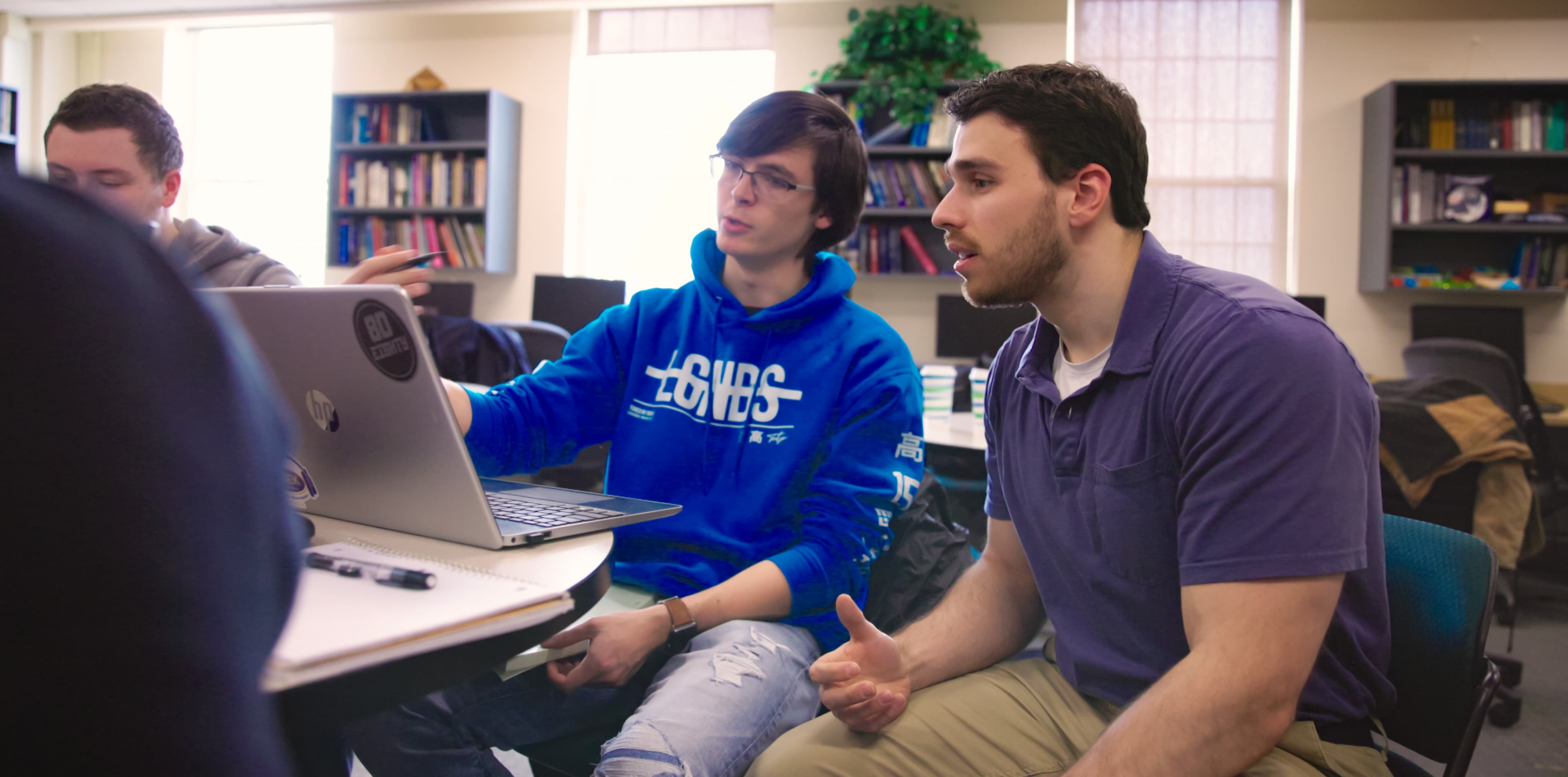 Professor working with student in math center