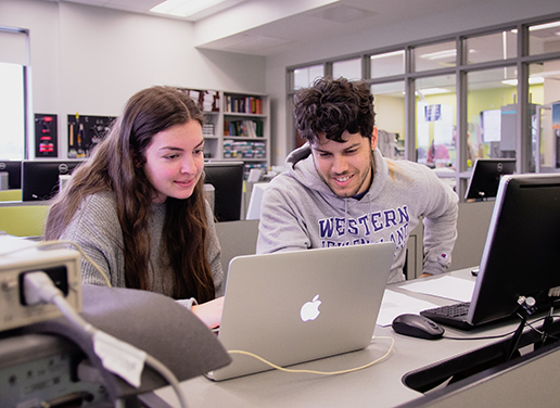 Two students working at a computer