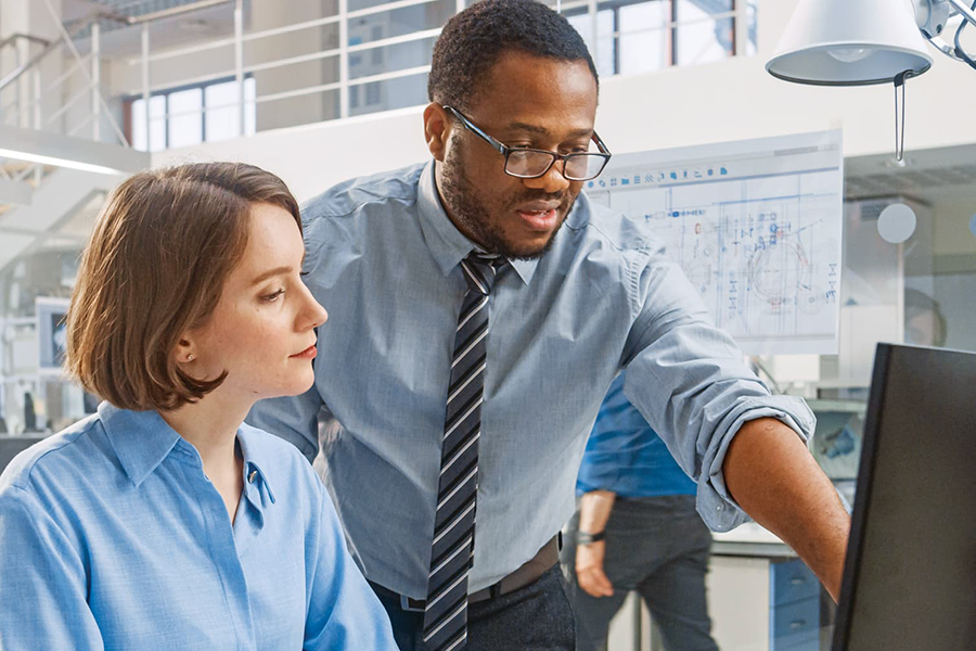 Man and woman working at computer