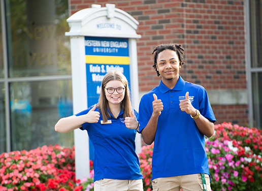 Campus Tour Guides give the thumbs up