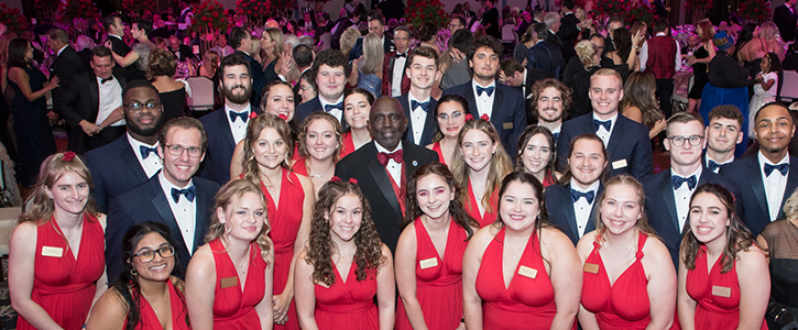 Dr. Johnson surrounded by student ambassadors from WNE at the Bright Nights Ball.