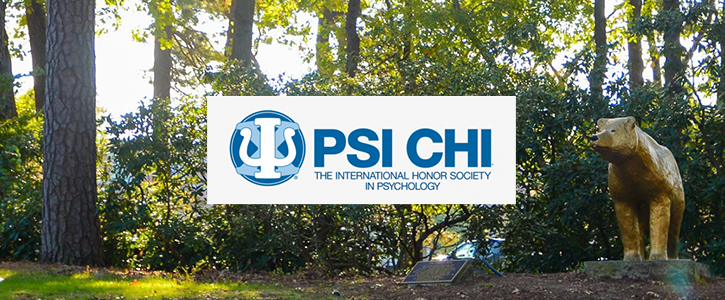 Psi Chi logo with campus background