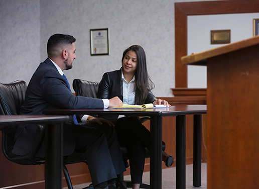 Two students in moot court room