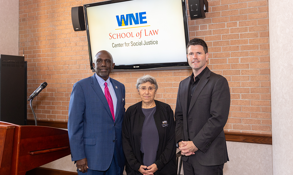 Dr. Johnson stands with partners from MassMutual and MGM at the WNE School of Law