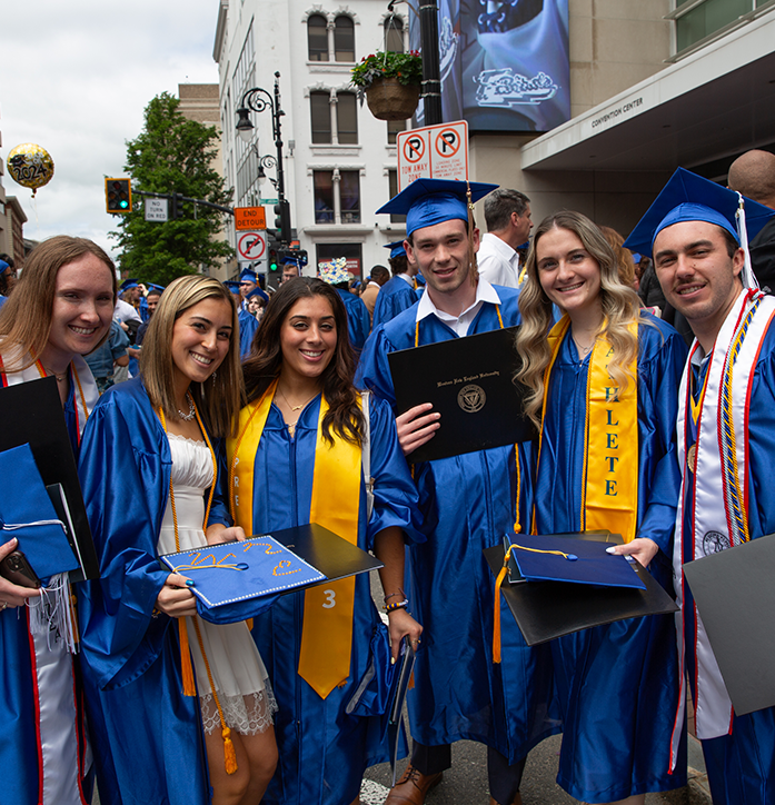 Students gather outside commencement