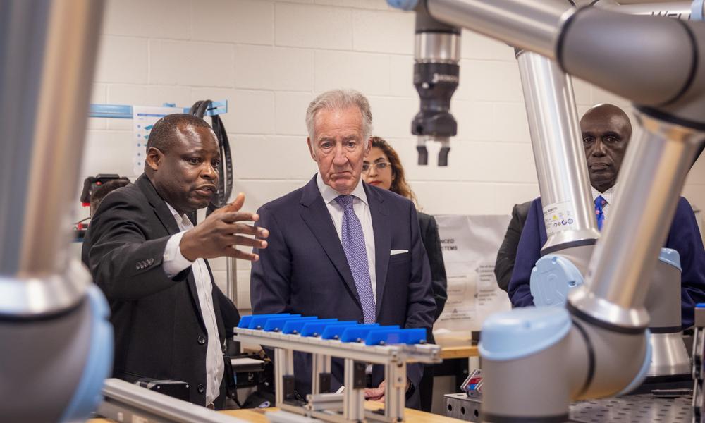 Professor demonstrates robot to Congressman Richard Neal.