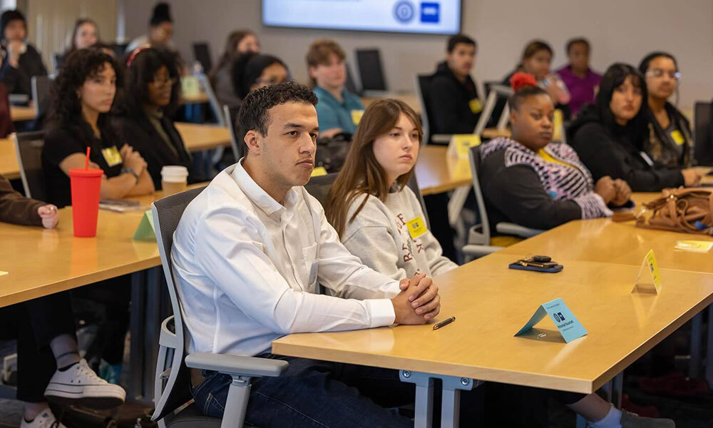 Photo of student at desks in a classroom