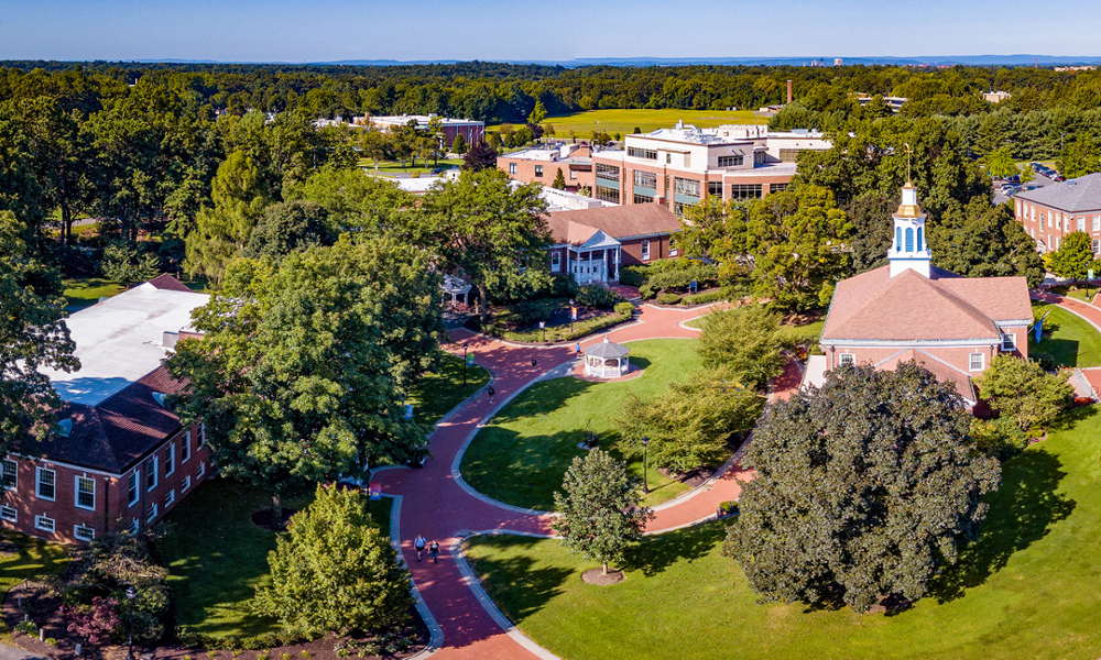 Panoramic shot of a very green summer WNE campus.