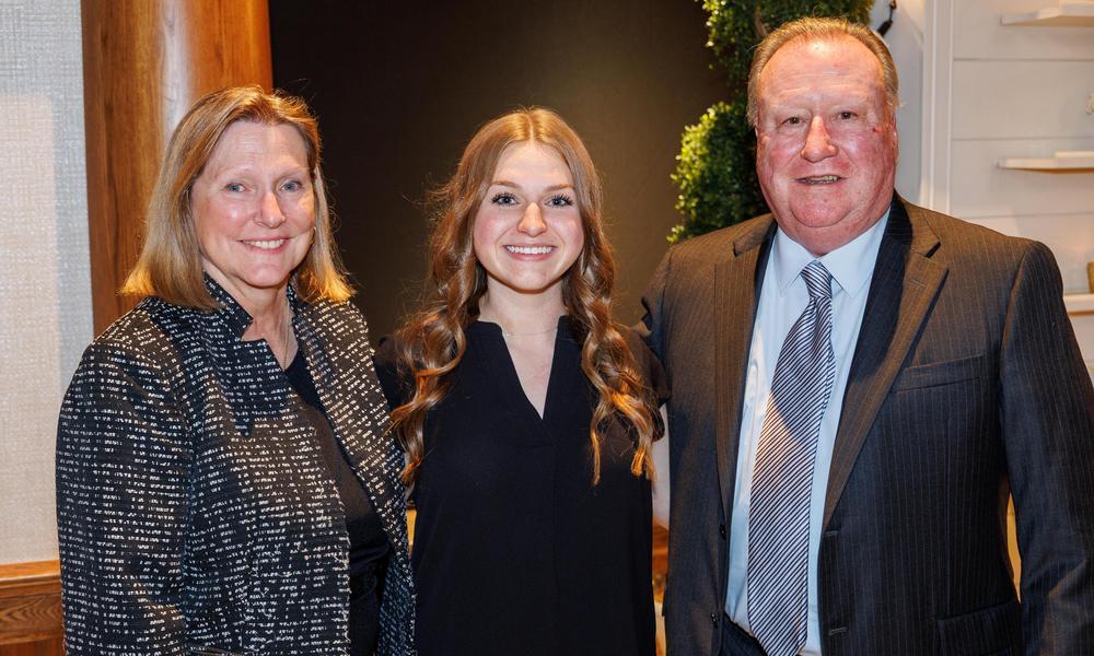 L to R: Diane Dame, Melia Pirog '28 and John Dame '77 pose for a photo