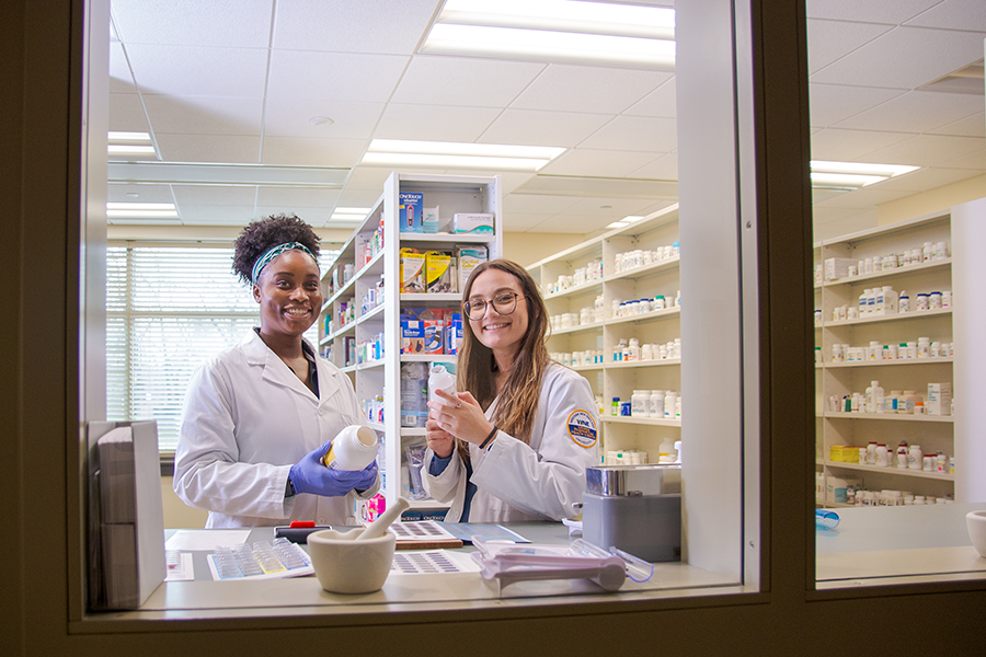 Students in model pharmacy