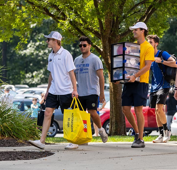 Group of students moving into res hall