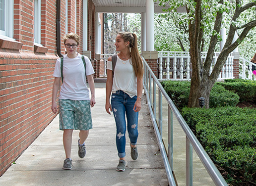 Students walking by the library