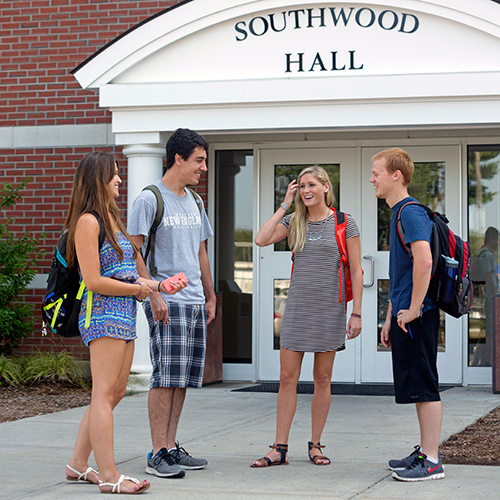 Students talking outside Southwood Hall.
