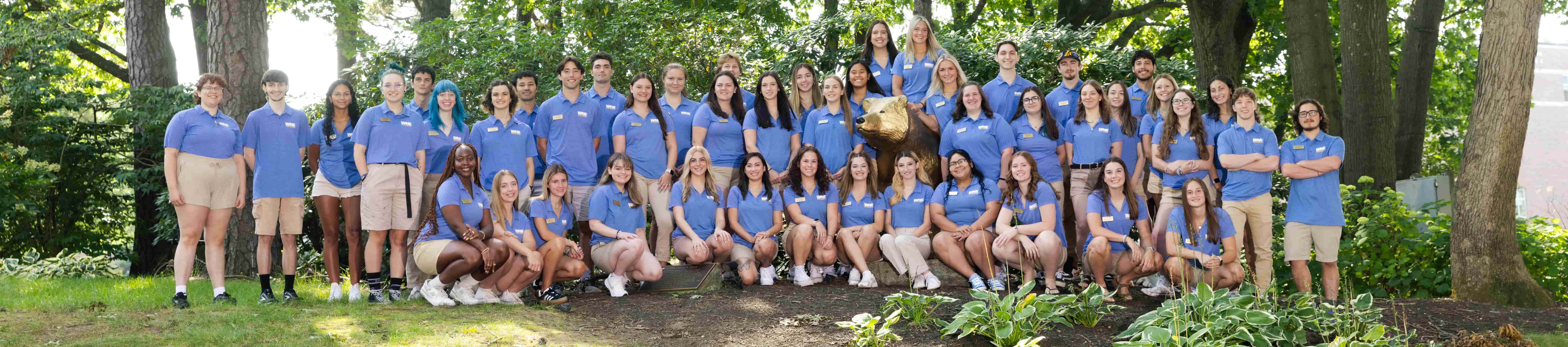 Group photo of peer advisors with the bear statue